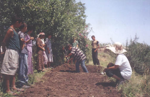 Irina conducts her double-digging exam in Kulba in 2003